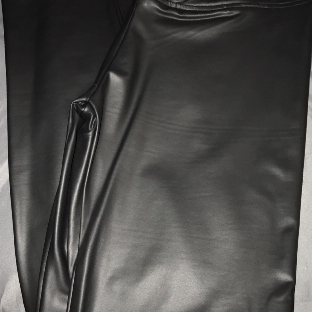 Black leather pants.. size large. New with tags..
